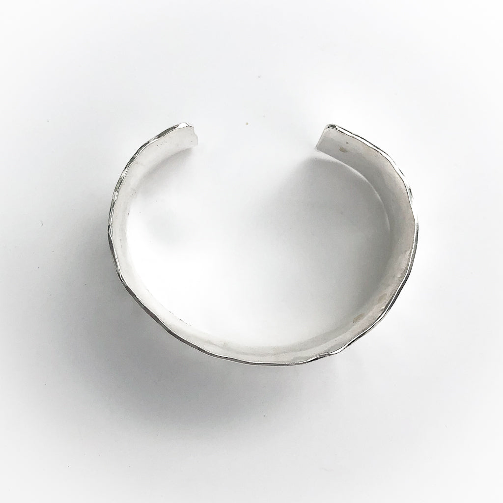 overhead view of Sterling Anticlastic Ball Pein Cuff by Judie Raiford