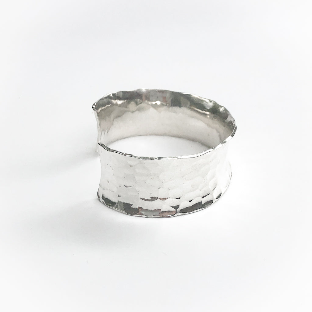 other side view of Sterling Anticlastic Ball Pein Cuff by Judie Raiford