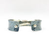 back side view of 3/4" Mom's Hammer Oxidized Sterling Anticlastic Cuff with 14k Gold Balls by Judie Raiford