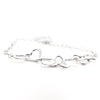 side angle view of Hammered Sterling Silver 7 Heart Necklace by Judie Raiford