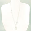 Long Leaf Lariat Necklace with White Pearl by Judie Raiford on white mannequin display bust