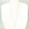 Long Leaf Lariat Necklace with White Pearl by Judie Raiford on white mannequin display bust