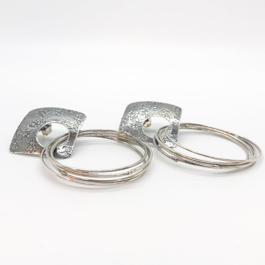 side angle view of Oxidized Sterling Square Top Slinky Post Earrings by Judie Raiford