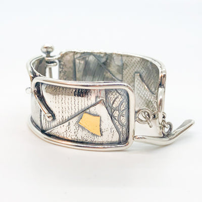 angle side view of sterling silver and 24k gold Flashed and Fused Bracelet by Judie Raiford