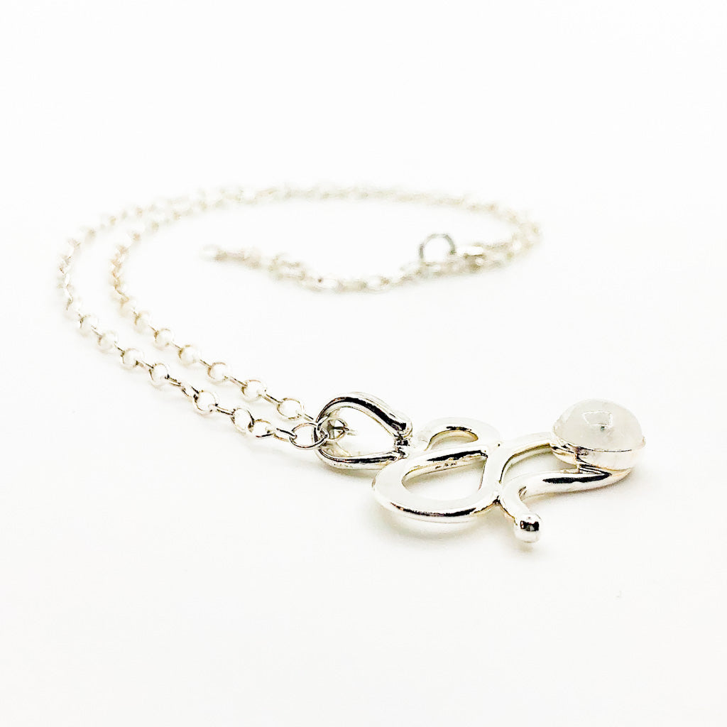 side angle view of Sterling Touch of Romance Necklace with Moonstone by Judie Raiford