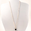 Black Onyx and 14k Gold Filled Necklace by Judie Raiford displayed on white mannequin