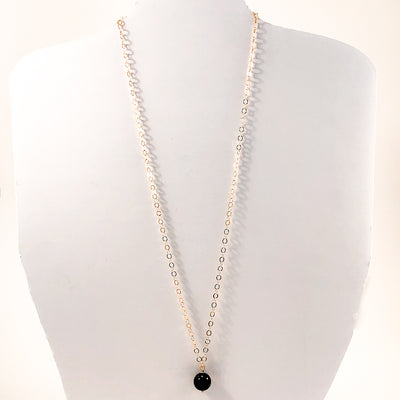 Black Onyx and 14k Gold Filled Necklace by Judie Raiford displayed on white mannequin