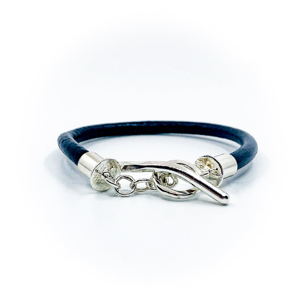 back view and detail of T bar clasp of Men's Sterling and Black Leather Bracelet by Judie Raiford