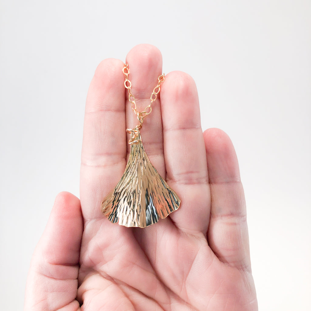 14k Gold Filled Ginkgo Necklace by Judie Raiford held in hand