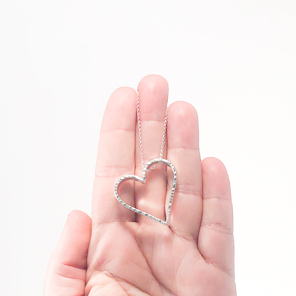 Small Jane Heart Necklace by Judie Raiford held in hand