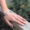 Sterling Orbit Bangle by Judie Raiford worn on model