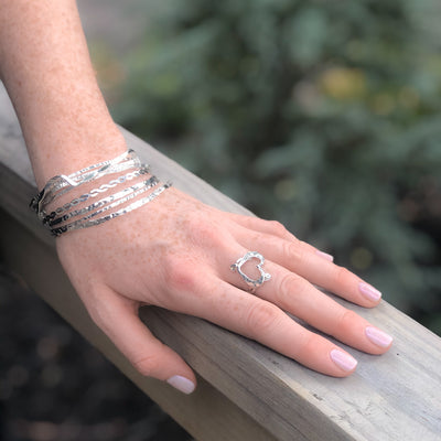 Sterling Orbit Bangle by Judie Raiford worn on model