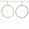 14k Gold Filled Large Orbit Earrings by Judie Raiford hanging on a wire