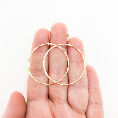 14k Gold Filled Large Orbit Earrings by Judie Raiford held in hand