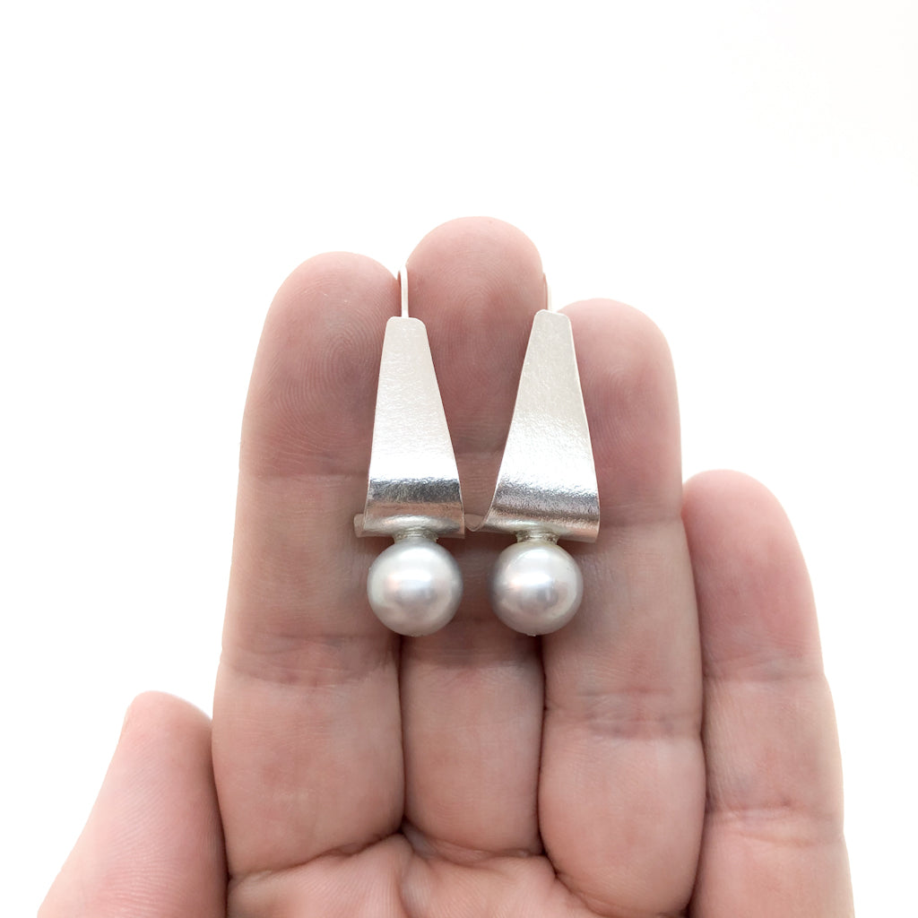 Sterling Tri Tuck Earrings with Gray Baroque Pearl by Judie Raiford held in hand