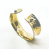 side angle view of 3/4" 14k Gold Filled 3/4" Ball Pein Anticlastic Cuff by Judie Raiford