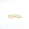 side angle view of 14k Gold Filled Ball Pein Hammered Donut Earrings by Judie Raiford