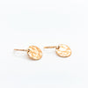 side angle view of 14k Gold Filled ball Pein Hammered Mini Circle Earrings by Judie Raiford