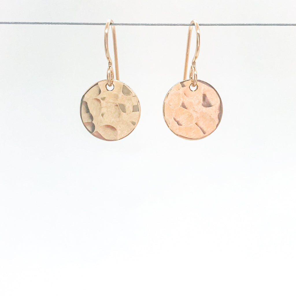 14k Gold Filled ball Pein Hammered Mini Circle Earrings by Judie Raiford hanging on wire