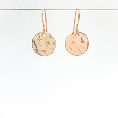 14k Gold Filled ball Pein Hammered Mini Circle Earrings by Judie Raiford hanging on wire