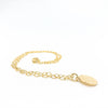 side angle view of 14k Gold Filled Hammered Mini Circle Necklace by Judie Raiford