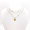 14k Gold Filled Hammered Mini Circle Necklace by Judie Raiford displayed on a white mannequin bust