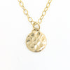 detail view of 14k Gold Filled Hammered Mini Circle Necklace by Judie Raiford