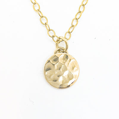 detail view of 14k Gold Filled Hammered Mini Circle Necklace by Judie Raiford