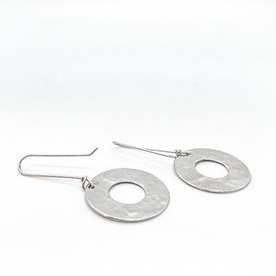 back side angle view of sterling silver Ball Pein Hammered Donut Earrings by Judie Raiford