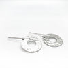front side angle view of sterling silver Ball Pein Hammered Donut Earrings by Judie Raiford