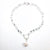 Sterling Irina Necklace with white coin pearl and white baroque pearl by Judie Raiford