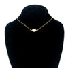 White Baroque Pearl on 14k Gold Chain Necklace by Judie Raiford displayed on black mannequin bust