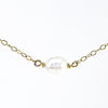 detail view of White Baroque Pearl on 14k Gold Chain Necklace by Judie Raiford