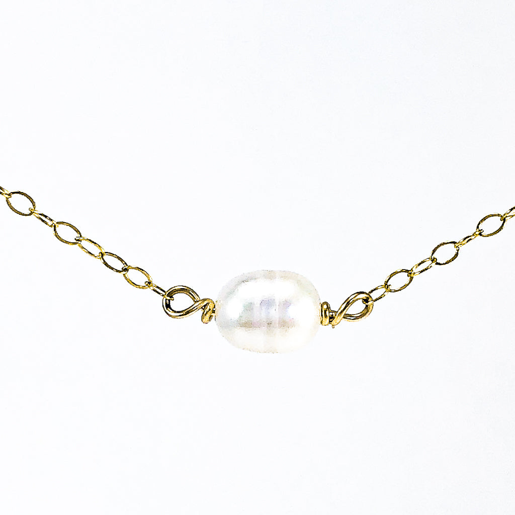 detail view of White Baroque Pearl on 14k Gold Chain Necklace by Judie Raiford