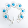 Flat Lay curl view of Not Naught Round Sterling Bracelet with Turquoise by Judie Raiford