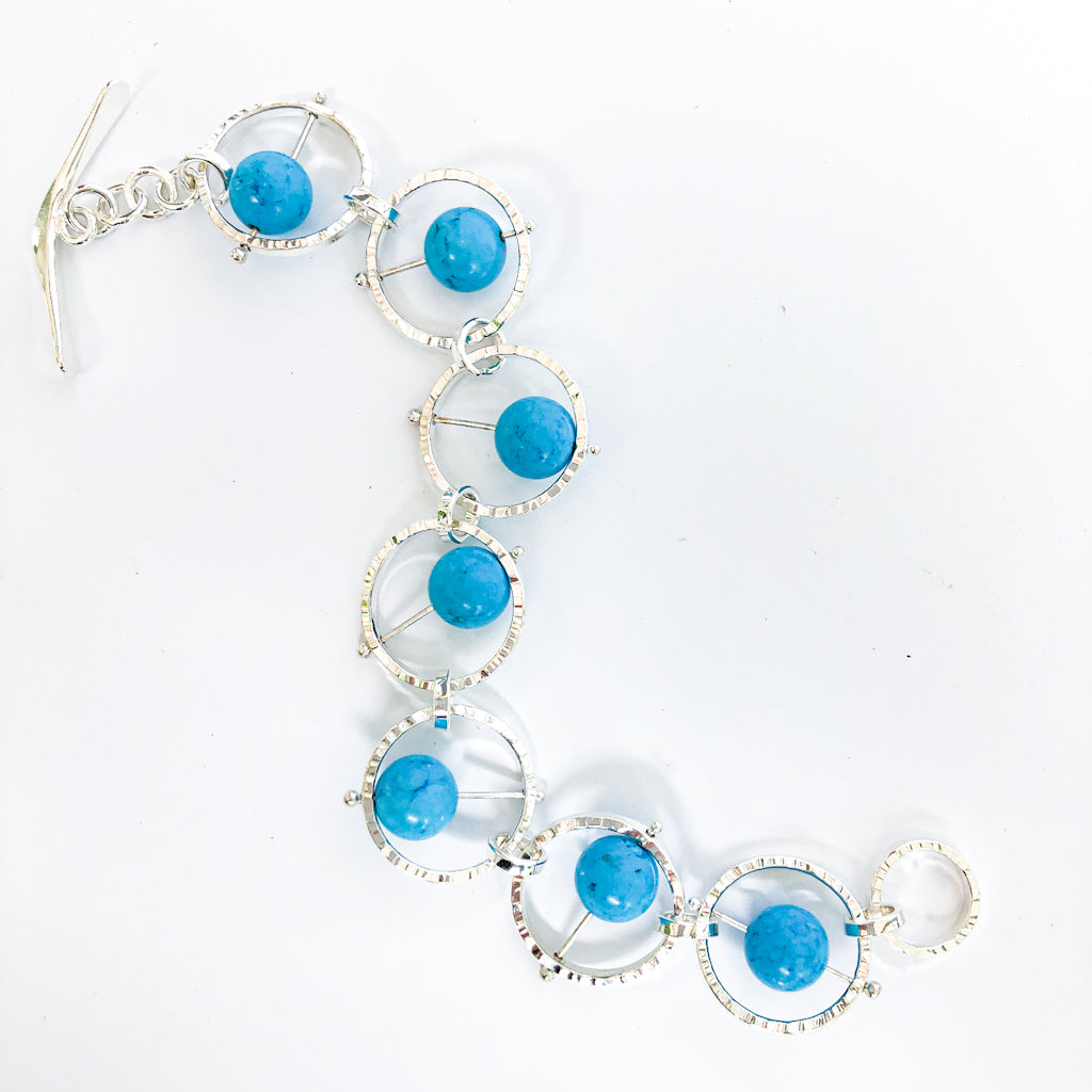 Flat Lay view of Not Naught Round Sterling Bracelet with Turquoise by Judie Raiford