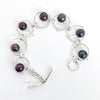 Flat Lay view of Not Naught Round Sterling Bracelet with Peacock Pearls by Judie Raiford