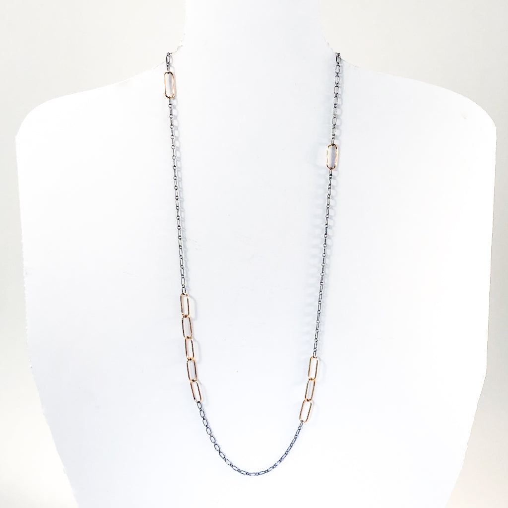 30" 14k Gold Filled Oval Links on Oxidized Sterling Chain Necklace by Judie Raiford hanging on a white mannequin bust