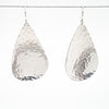 sterling silver Sinclastic Pear Shaped Earrings by Judie Raiford hanging on wire