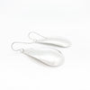 back side angle view of sterling silver Sinclastic Pear Shaped Earrings by Judie Raiford