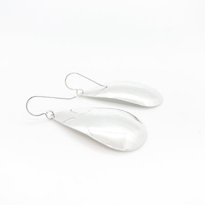 back side angle view of sterling silver Sinclastic Pear Shaped Earrings by Judie Raiford