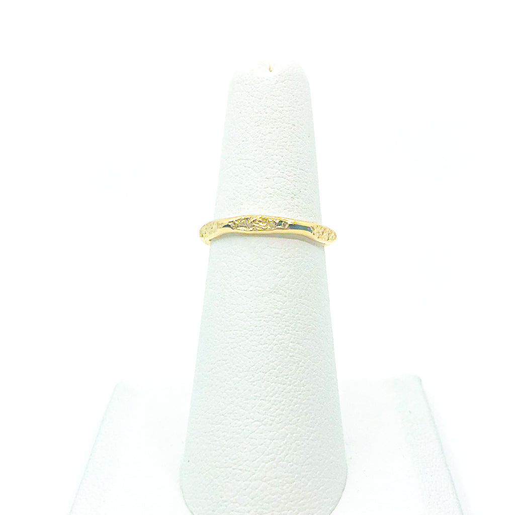 14k Gold Filled Hammered Stack Ring by Judie Raiford displayed on white ring stand