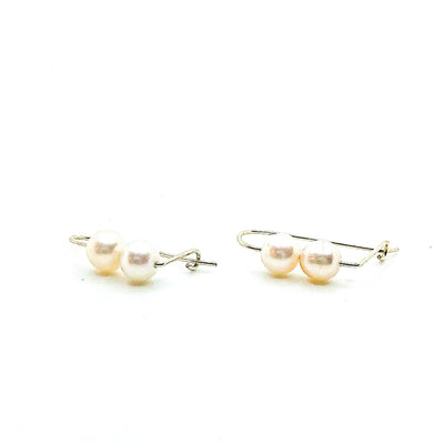 side angle view of Sterling Two Pearl Earrings by Judie Raiford