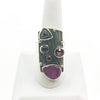 Silver Platter Ring with 14k, Ruby, Garnet and Zircon by Judie Raiford on white ring display stand