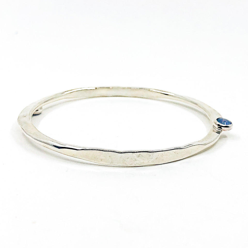 side angle view of Sterling Naught Bangle with Opal by Judie Raiford