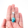 sterling silver Big Juicy Stone Necklace with Turquoise by Judie Raiford held in hand