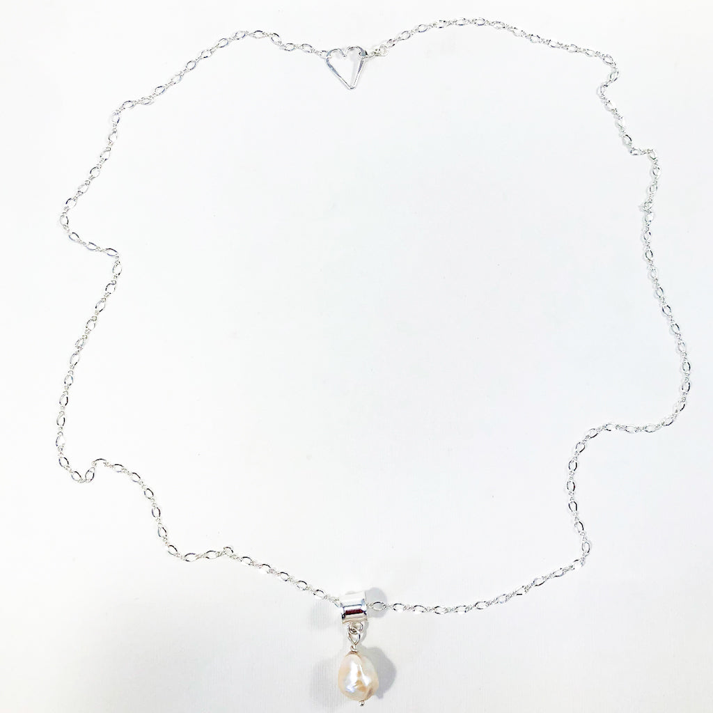 flat lay view of Big Juicy Pearl Necklace with White Baroque Pearl by Judie Raiford