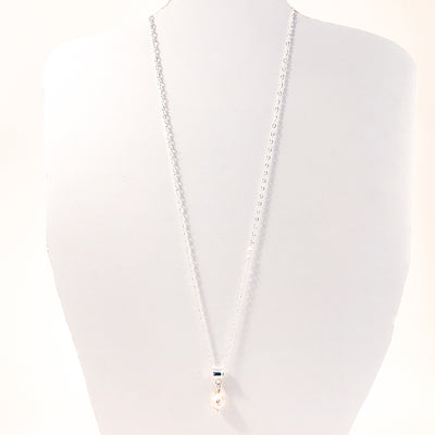 Big Juicy Pearl Necklace with White Baroque Pearl by Judie Raiford hanging on white mannequin cut out