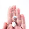 Big Juicy Pearl Necklace with White Baroque Pearl by Judie Raiford held in hand