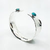 side angle view of Sterling Anticlastic Cuff with Turquoise by Judie Raiford